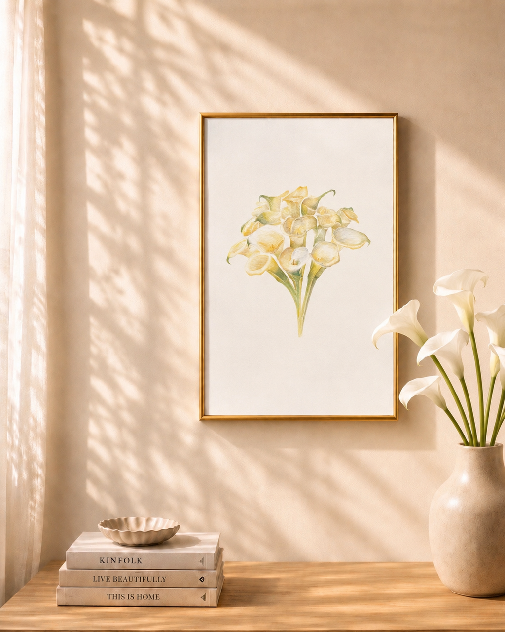 Framed floral print on a wall with books and a vase below